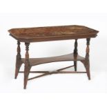 An Aesthetic Movement mahogany library table, in the manner of Charles Bevan, the shaped rectangular