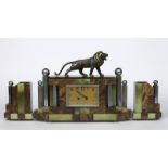 A Valery a patintated metal and onyx mantel clock garniture, the central shaped rectangular