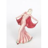 A Katshutte model of a woman, modelled dancing in flowing pink dress and cape, printed factory mark,