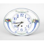 A Secessionist enamel wall clock, the oval face printed with cornucopia of fruit, in colours on a