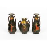 A Royal Doulton Series Ware three vase garniture designed by Charles Noke, the central vase swollen,