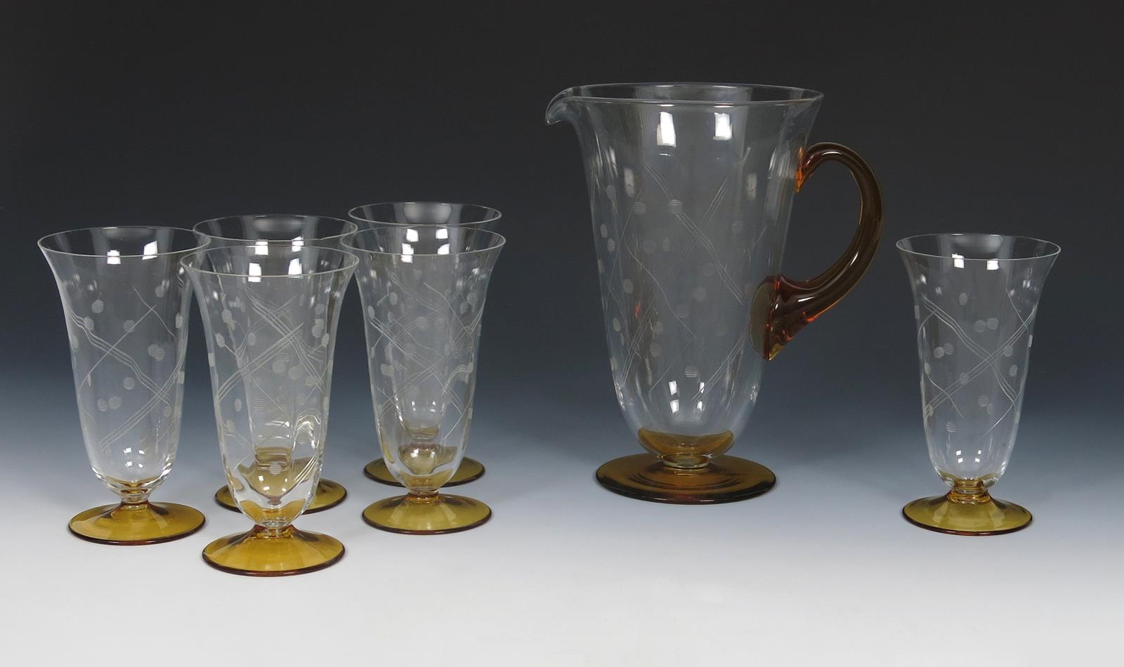 An English Art Deco lemonade jug and six glasses in the manner of Stuart Glass, flaring