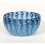 A Moncrieff's Monart Ware glass bowl, clear glass with blue graduating to purple stripes, with