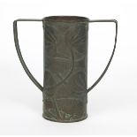 A John Williams repousse patinated copper vase, with applied twin-handles, hammered in low relief