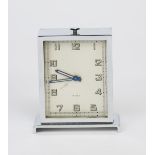 An Art Deco chrome travelling timepiece in original fitted case retailed by Harrods, rectangular