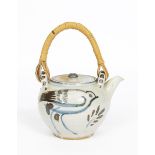 Seth Cardew (1934-2016) a Winchcombe Pottery teapot and cover, with cane handle, painted with a