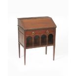 A Liberty & Co Anglo-Persian mahogany bureau, on four tapering legs, with arched under carriage