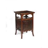 An Anglo-Japanese mahogany music cupboard in the manner of E.W. Godwin, flaring square legs,