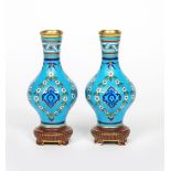 A pair of Minton's porcelain Cloisonne vases in the manner of Dr Christopher Dresser, the swollen