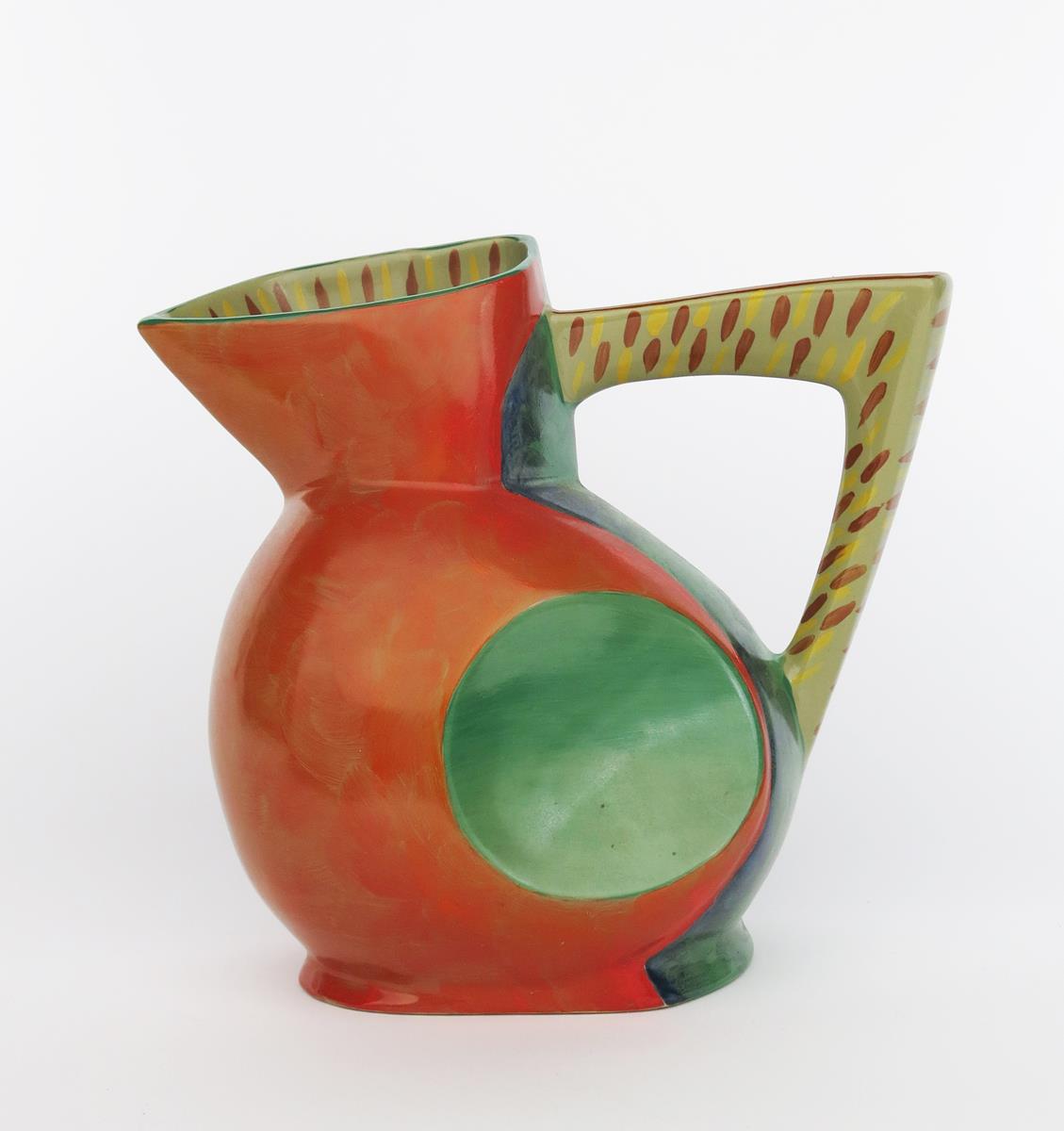 A Flesh Pots jug designed by Morris Rushton, geometric form with angular handle, painted in vivid