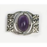 A silver and amethyst brooch, probably Norwegian, pierced and cast with foliate panels, set with