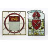 A stained glass heraldic window, square, the heraldic shield with lion passant, inside red