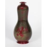 A Bernard Moore flambe gourd vase by Cicery Jackson, painted with a design of berries and spider's