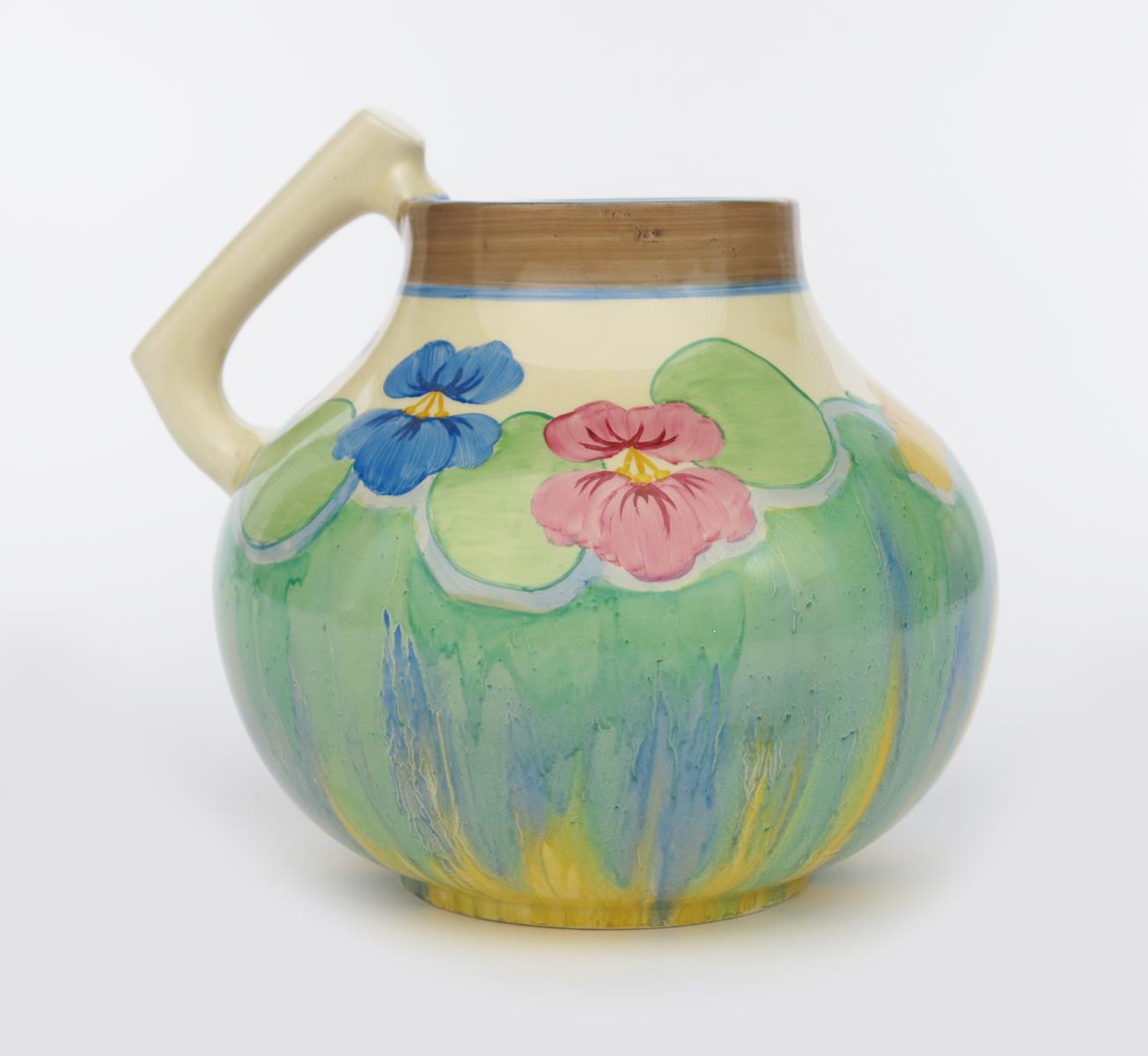 'Delecia Pansies' a Clarice Cliff Bizarre 634 single-handled vase, painted in colours printed