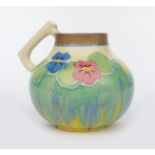 'Delecia Pansies' a Clarice Cliff Bizarre 634 single-handled vase, painted in colours printed