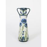 'Blue Poppy' a James Macintyre & Co Florian Ware twin-handled vase designed by William Moorcroft,