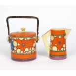 'Broth' a Clarice Cliff Fantasque Bizarre Cylindrical Biscuit barrel and cover and a Conical jug,