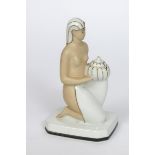 A Robj porcelain brulee parfums, model no.221, modelled as kneeling semi-naked Egyptian maiden