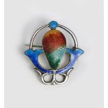 An Art Nouveau James Fenton silver and enamel brooch, pierced and cast with a stylised flower,