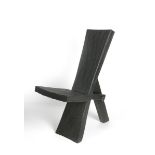 ‡ Robert Kilvington a scorched oak chair, carved plank construction with polished steel bolt,