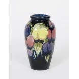 'Wisteria' a Moorcroft Pottery vase designed by William Moorcroft, shouldered form, painted in