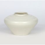 A Wedgwood Pottery vase designed by Keith Murray, compressed form, with stepped shoulder, covered in