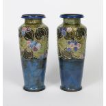 A pair of Art Nouveau Royal Doulton stoneware vases by Joan Honey, shouldered baluster form with