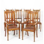 A set of eight Art Nouveau mahogany dining chairs, comprising two carvers and six chairs, each