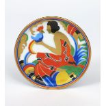 A Rosenthal porcelain dish, printed and painted with an Art Deco lady holding an exotic bird in