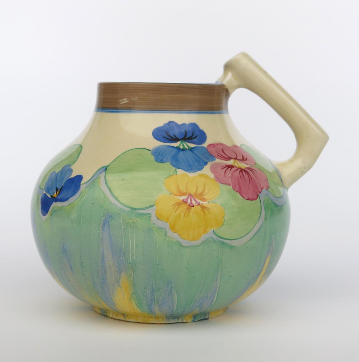 'Delecia Pansies' a Clarice Cliff Bizarre 634 single-handled vase, painted in colours printed - Image 2 of 3