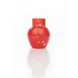 A rare Moncrieff's Monart Ware vase, milky-off white liner cased in red with millefiori cane