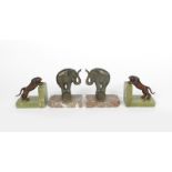 A pair of patinated metal performing elephant book ends the design attributed to Hippolyte Moreau,