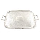 A George III silver two-handled tray, by Paul Storr, London 1809, rectangular form, leaf capped