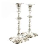 A pair of George II silver candlesticks, by Robert Rew, London 1758, knopped baluster stems with