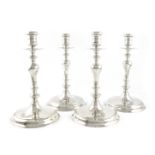 A set of four silver candlesticks, by L. Crichton, London 1918, in the seventeenth century manner,