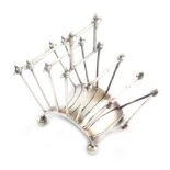 After Christopher Dresser, an electroplated seven bar toast rack, maker's mark of T.W, fan shape,