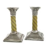 λA pair of Edwardian silver and ivory candlesticks, by the Harrison Brothers, Sheffield 1903, the