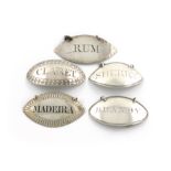 A collection of five George III silver wine labels, one unmarked, oval form, beaded, thread and
