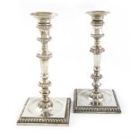 A pair of George II cast silver candlesticks, by Edward Wakelin, London 1753, tapering knopped