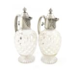 A matched pair of late-Victorian silver-mounted claret jugs, by Holland, Aldwinckle & Slater, London