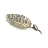 A Victorian cast silver caddy spoon, by George Adams, London 1862, leaf form, simulated snake ring