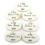 A set of seven 19th century Ceramic bin labels, oval form, titled in black 'No.103 St. GUIRONS