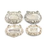 A small collection of four early 19th century silver wine labels, various dates and makers, oval