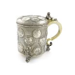 A 19th century continental silver coin peg tankard, maker's mark partially worn, probably