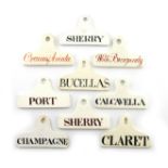 A collection of nine 19th century creamware and pearlware bin labels, coat hanger form, tilted '