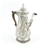 A George III silver coffee pot, by Francis Crump, London 1765, baluster form, embossed with