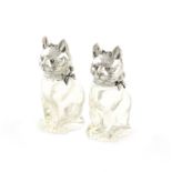 A pair of German novelty silver-mounted glass cat pepper pots, maker's mark M.M, modelled in