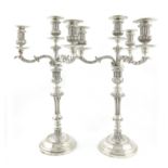 A pair of Victorian silver four-light candelabra, by Robert Garrard, London 1851, the drip pans
