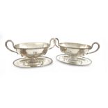 A pair of George III old Sheffield plated sauce tureens and stands, unmarked, probably by Tudor