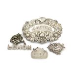 A small collection of four antique silver and electroplated labels, comprising: a miniature 'cut-out